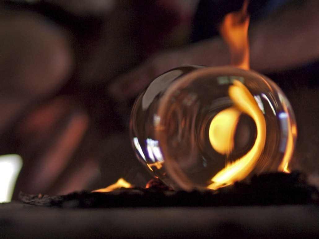 Clear handblown glass on fire from the kiln